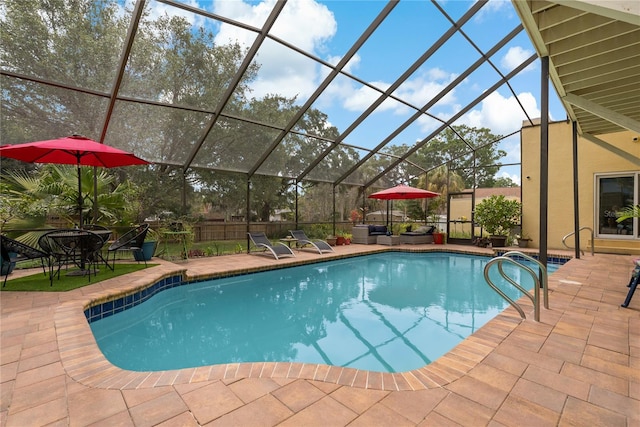 view of swimming pool featuring a lanai and a patio