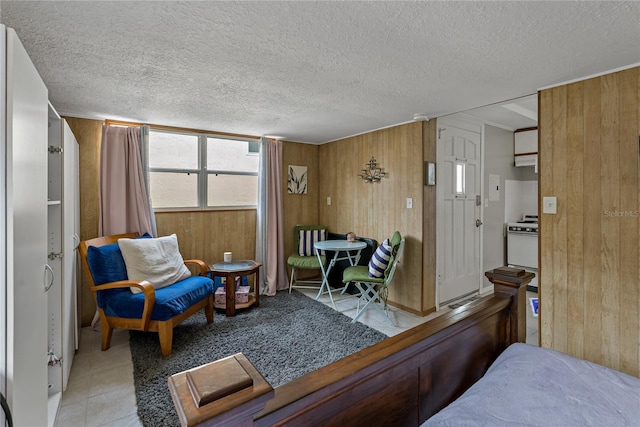 interior space with wooden walls and a textured ceiling