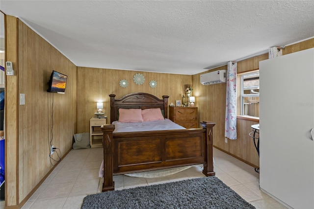 tiled bedroom with a textured ceiling, a wall mounted air conditioner, and wooden walls