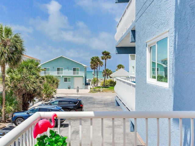 exterior space with a water view and a balcony