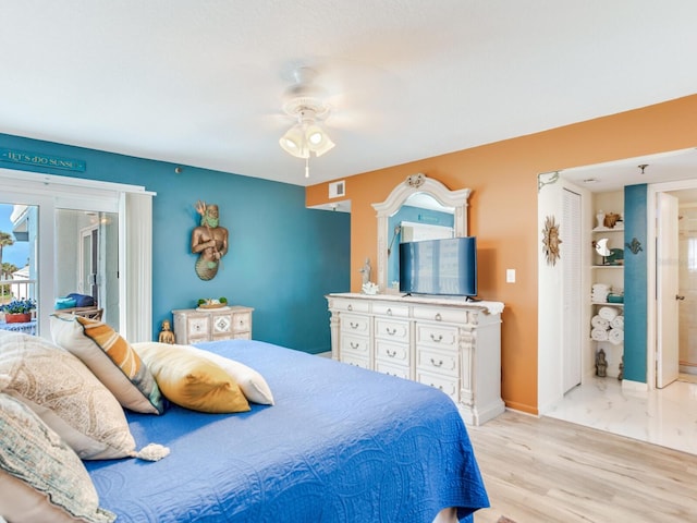 bedroom featuring access to exterior, ceiling fan, and light hardwood / wood-style flooring