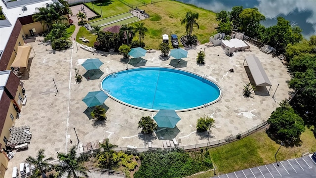 view of pool featuring a yard and a patio area