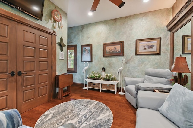 entrance foyer with ceiling fan and dark wood finished floors