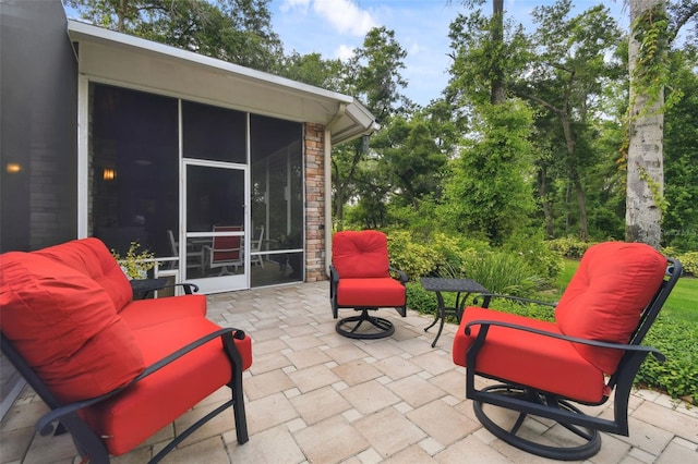 view of patio / terrace featuring a sunroom