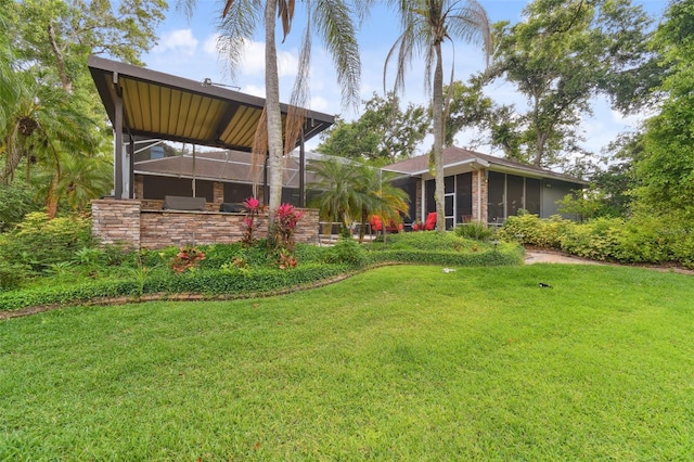 view of yard with a lanai and a sunroom