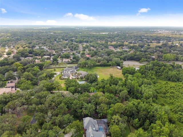 bird's eye view featuring a wooded view