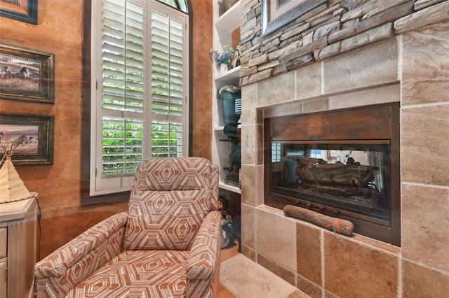 sitting room with a multi sided fireplace