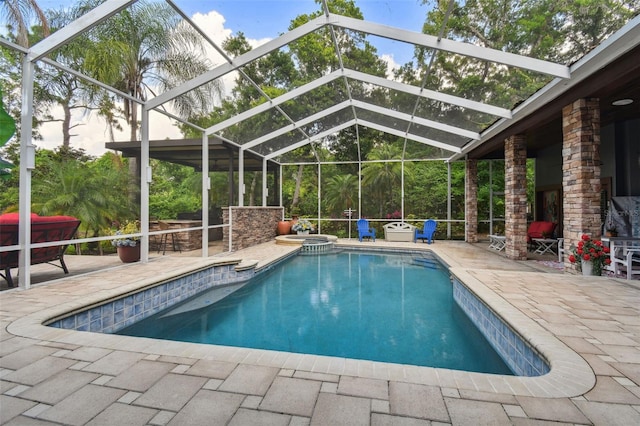 view of pool featuring a patio area and a lanai