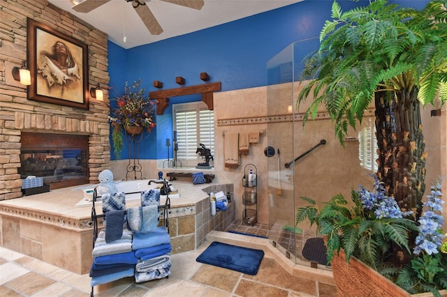 view of patio / terrace with ceiling fan and an outdoor stone fireplace