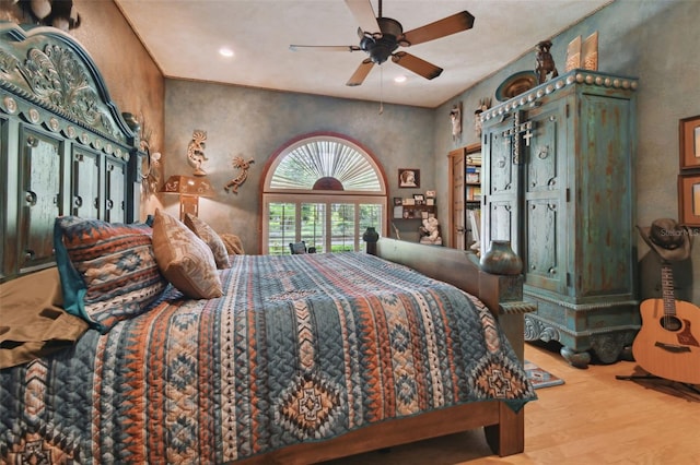 bedroom featuring a ceiling fan, recessed lighting, and wood finished floors