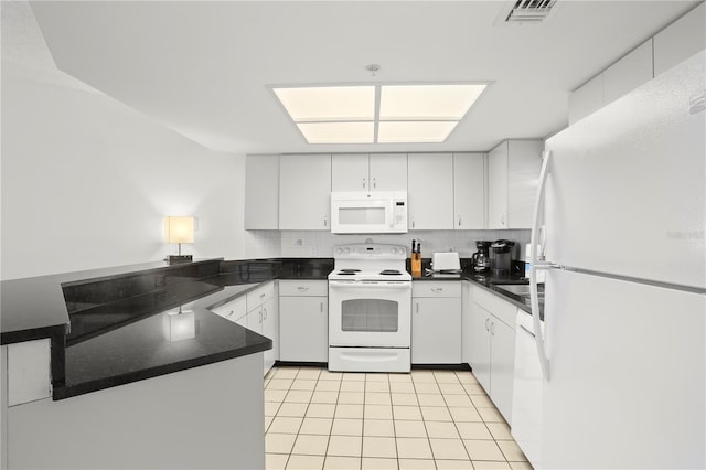 kitchen featuring white cabinetry, white appliances, and light tile patterned flooring