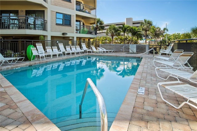 view of swimming pool featuring a patio area