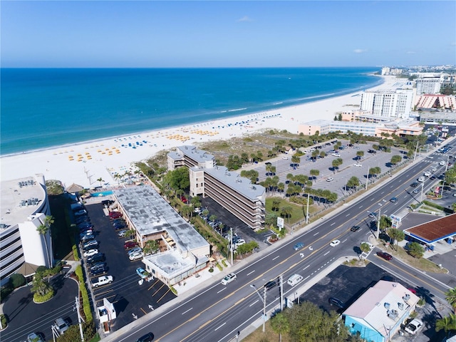 aerial view featuring a water view and a view of the beach