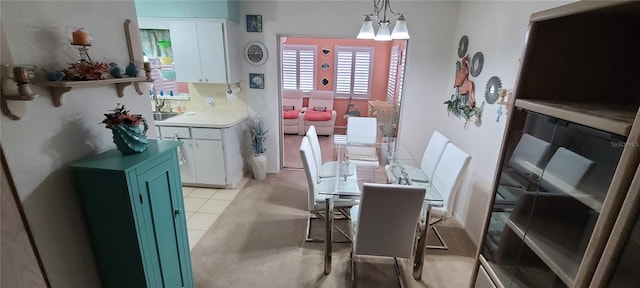 tiled dining area with a chandelier