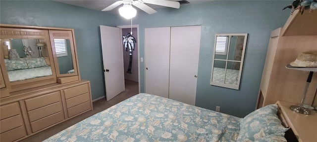 bedroom with ceiling fan and multiple windows