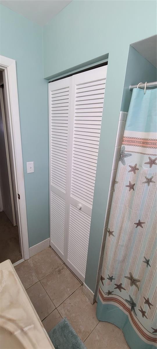 bathroom featuring tile floors