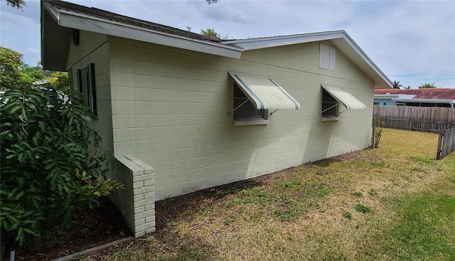 view of property exterior featuring a yard