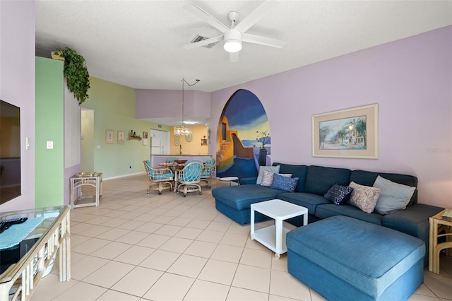 tiled living room featuring ceiling fan