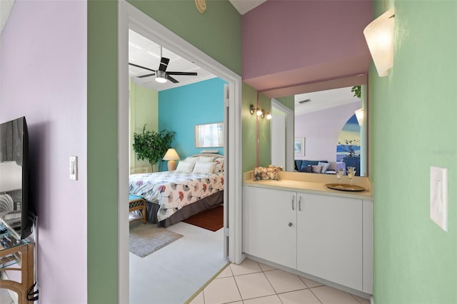 bedroom featuring ceiling fan and light tile flooring