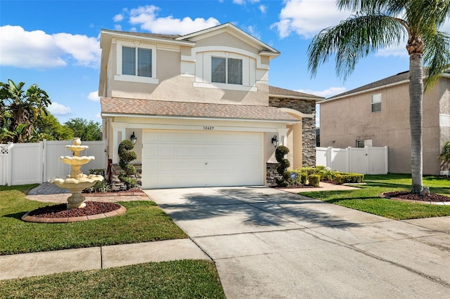 view of front of house featuring a front yard and a garage