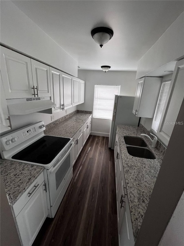 kitchen featuring light stone countertops, double oven range, dark wood-type flooring, white cabinets, and sink