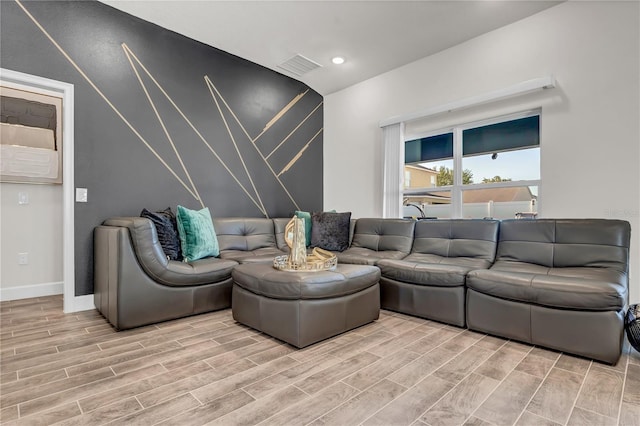 living room with light hardwood / wood-style flooring