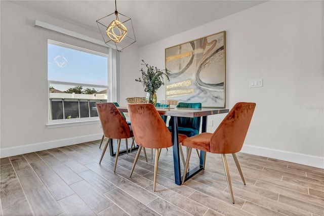 dining room with a notable chandelier and hardwood / wood-style floors