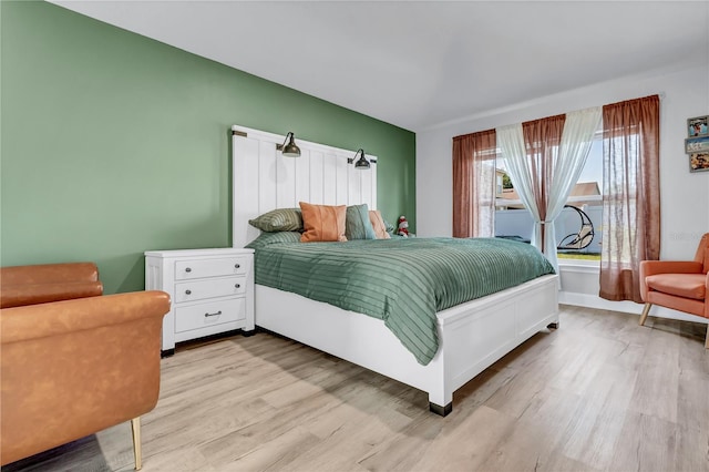 bedroom with hardwood / wood-style flooring