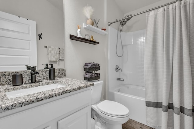 full bathroom featuring vanity, shower / bathtub combination with curtain, and toilet