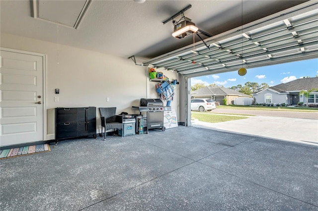 garage featuring a garage door opener