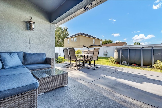 view of patio / terrace featuring a pool