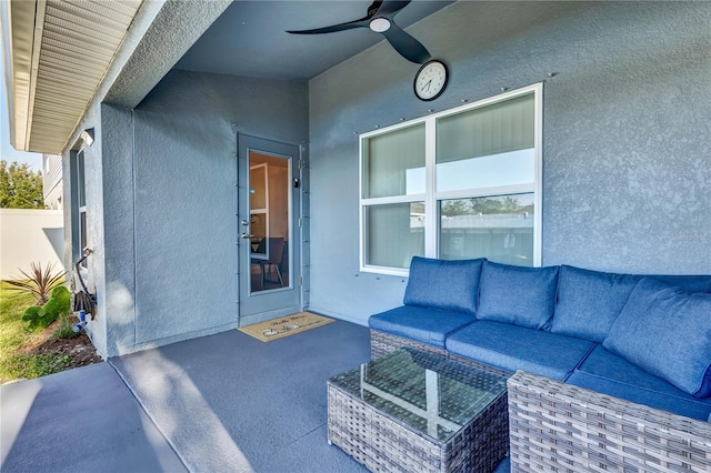 view of patio / terrace with an outdoor living space and ceiling fan