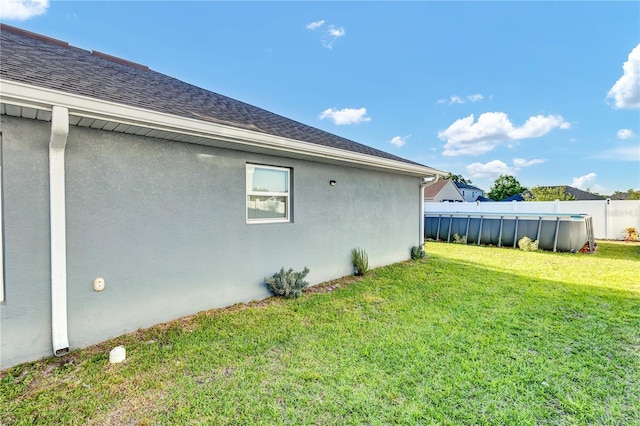 view of side of property featuring a yard