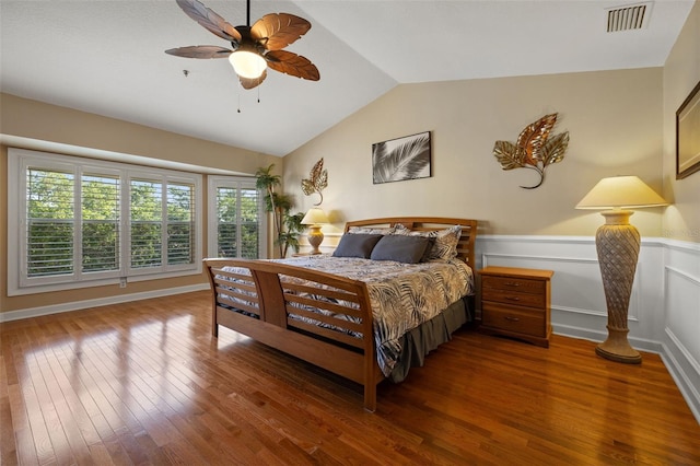 bedroom with ceiling fan, dark hardwood / wood-style flooring, and lofted ceiling