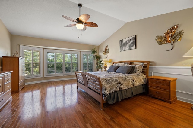 bedroom featuring wood-type flooring, ceiling fan, and lofted ceiling