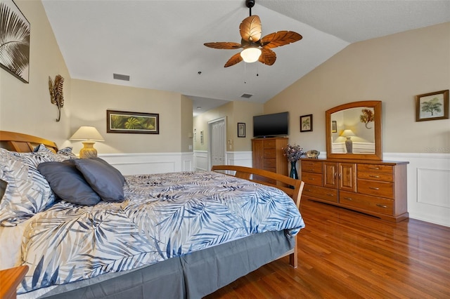 bedroom featuring ceiling fan, hardwood / wood-style floors, and lofted ceiling