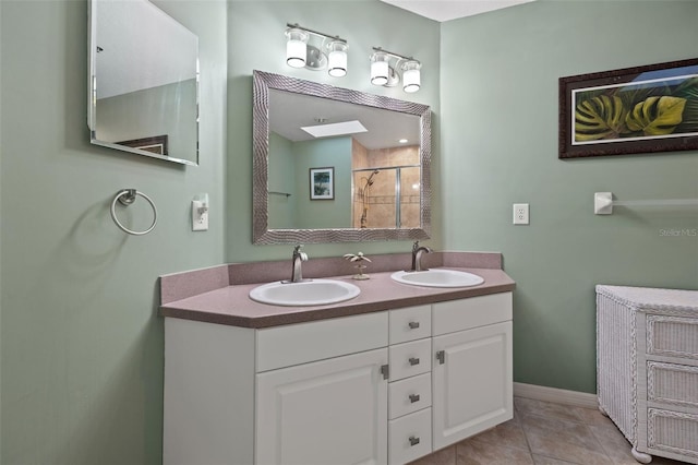 bathroom with vanity with extensive cabinet space, double sink, and tile flooring