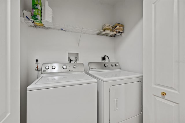 washroom featuring hookup for an electric dryer, washing machine and dryer, and washer hookup