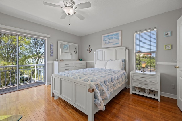 bedroom with wood-type flooring, ceiling fan, and access to exterior