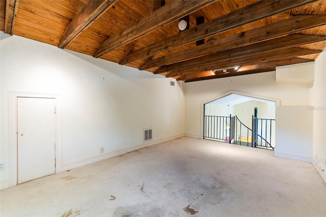 bonus room featuring beam ceiling, wood ceiling, and light colored carpet