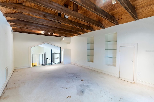 unfurnished room featuring beam ceiling and wood ceiling