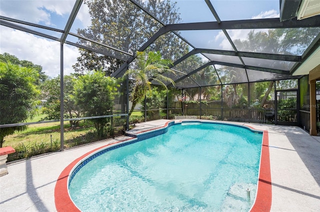 view of pool featuring a patio area and a lanai