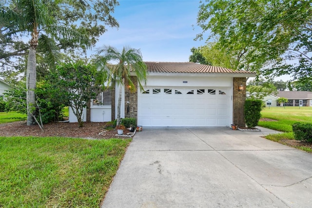 view of front of house featuring a front lawn and a garage