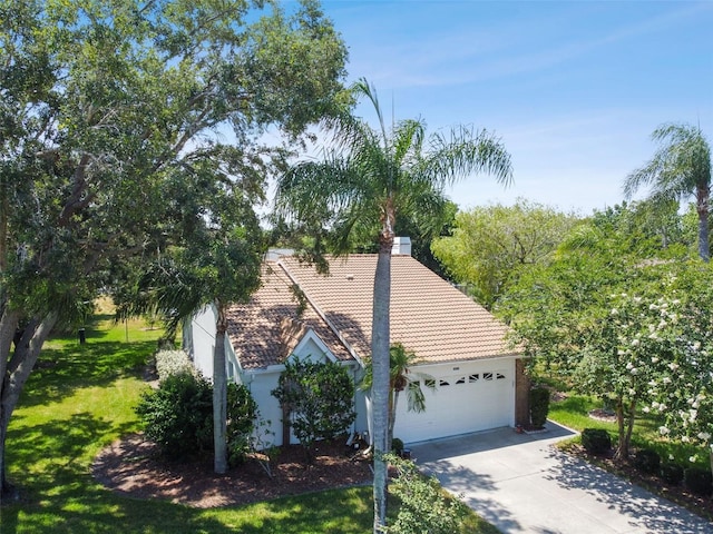 view of front facade with a front yard and a garage