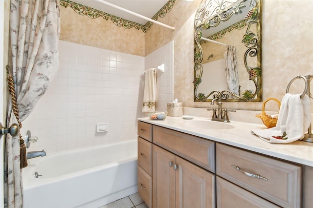 bathroom with shower / bath combo with shower curtain, vanity, and tile patterned flooring