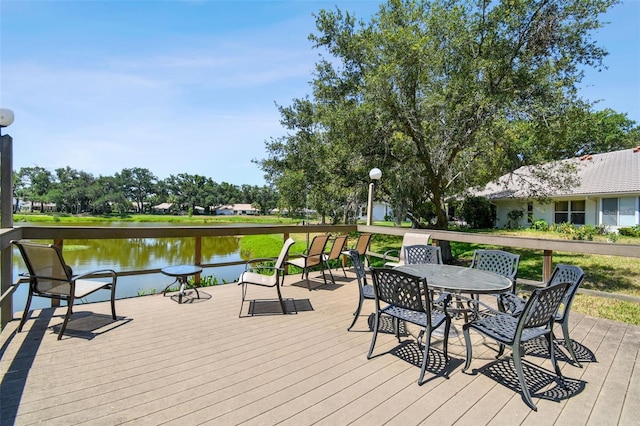 wooden deck featuring a water view