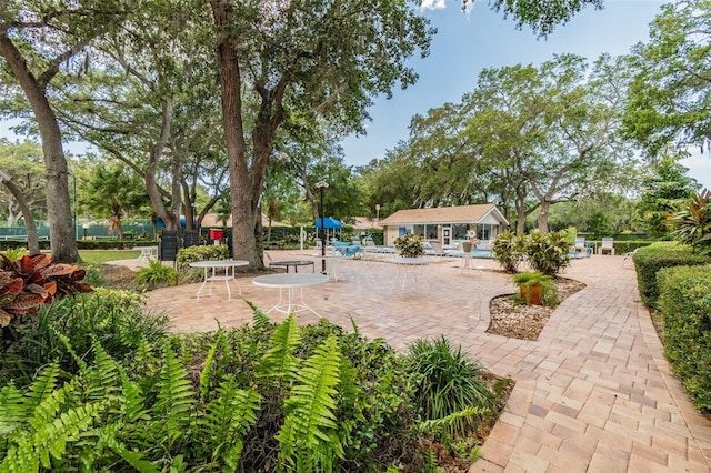 view of patio with an outbuilding