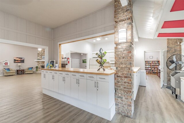 kitchen featuring light wood-type flooring and white cabinetry