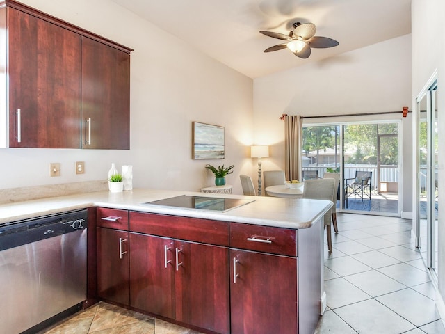 kitchen featuring stainless steel dishwasher, ceiling fan, light tile patterned floors, stovetop, and kitchen peninsula