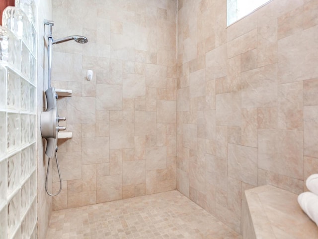 bathroom with tiled shower